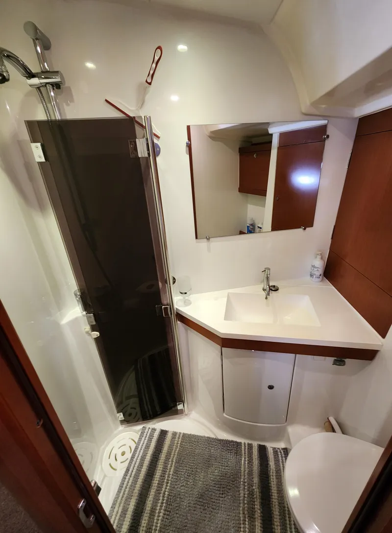 Slide: The Image of Beneteau Oceanis 50 yacht bathroom, 2012 model, featuring shower, sink, and toilet. - 33