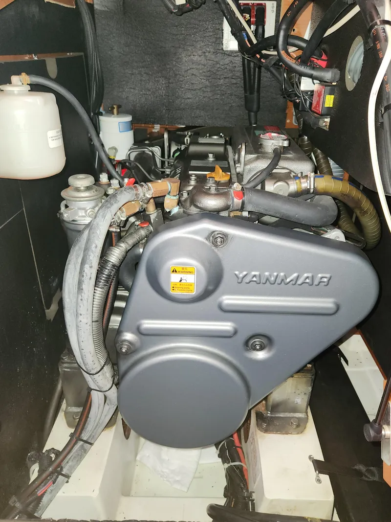 Slide: The Image of Yanmar engine in a 2012 Beneteau Oceanis 50 sailboat, showcasing mechanical components. - 39