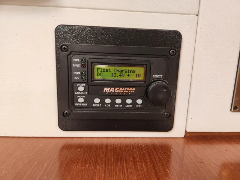 Slide: The Image of Control panel on a 2012 Beneteau Oceanis 50, displaying float charging status. - 41
