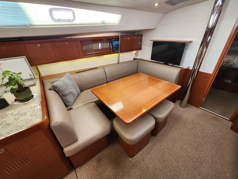 Slide: The Image of Luxurious interior of 2012 Beneteau Oceanis 50 yacht with elegant dining area and modern furnishings. - 44