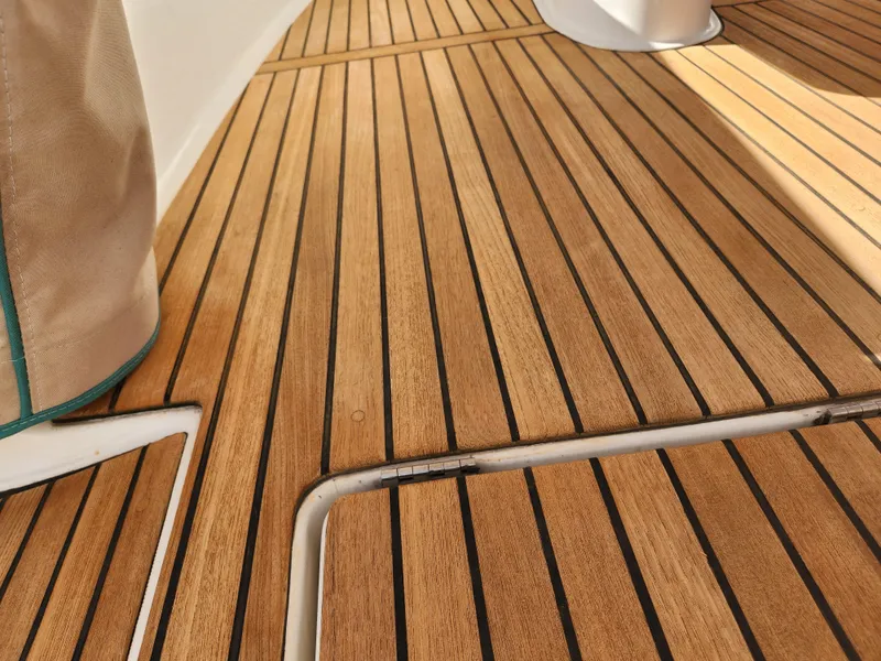 Slide: The Image of Teak deck of 2012 Beneteau Oceanis 50 sailboat, showcasing elegant wood finish. - 48