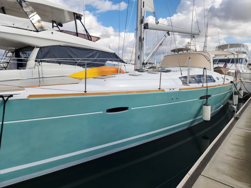 Slide: The Image of Beneteau Oceanis 50 sailboat, 2012 model, docked at marina under cloudy sky. - 6