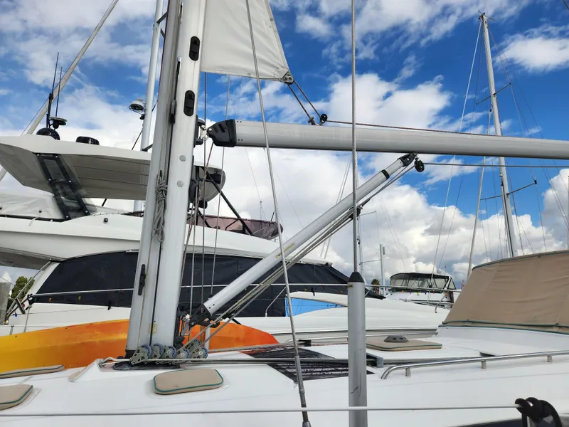 Slide: The Image of 2012 Beneteau Oceanis 50 sailboat with mast and rigging against a cloudy sky. - 8