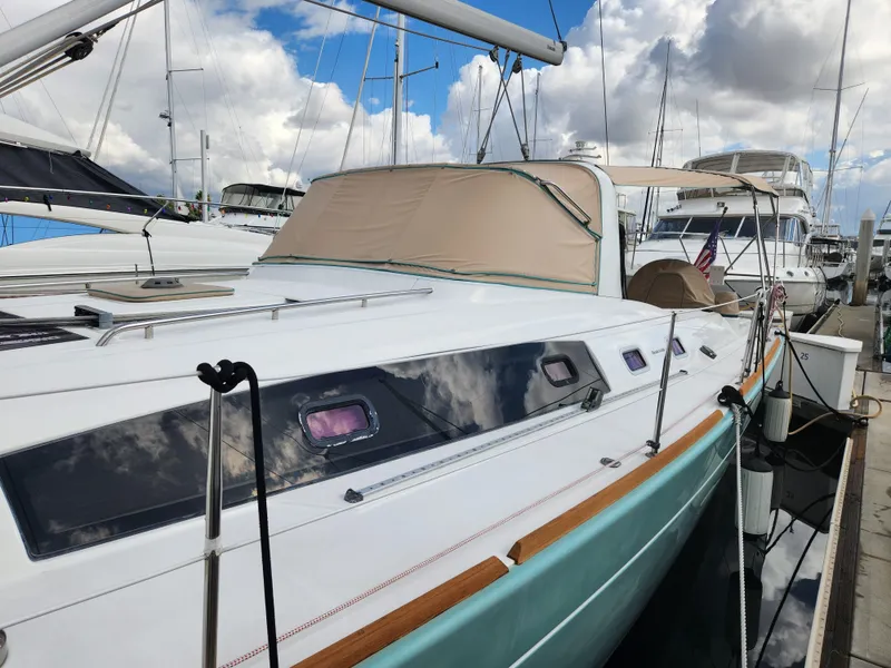 Slide: The Image of 2012 Beneteau Oceanis 50 sailboat docked, featuring sleek design and modern amenities. - 9