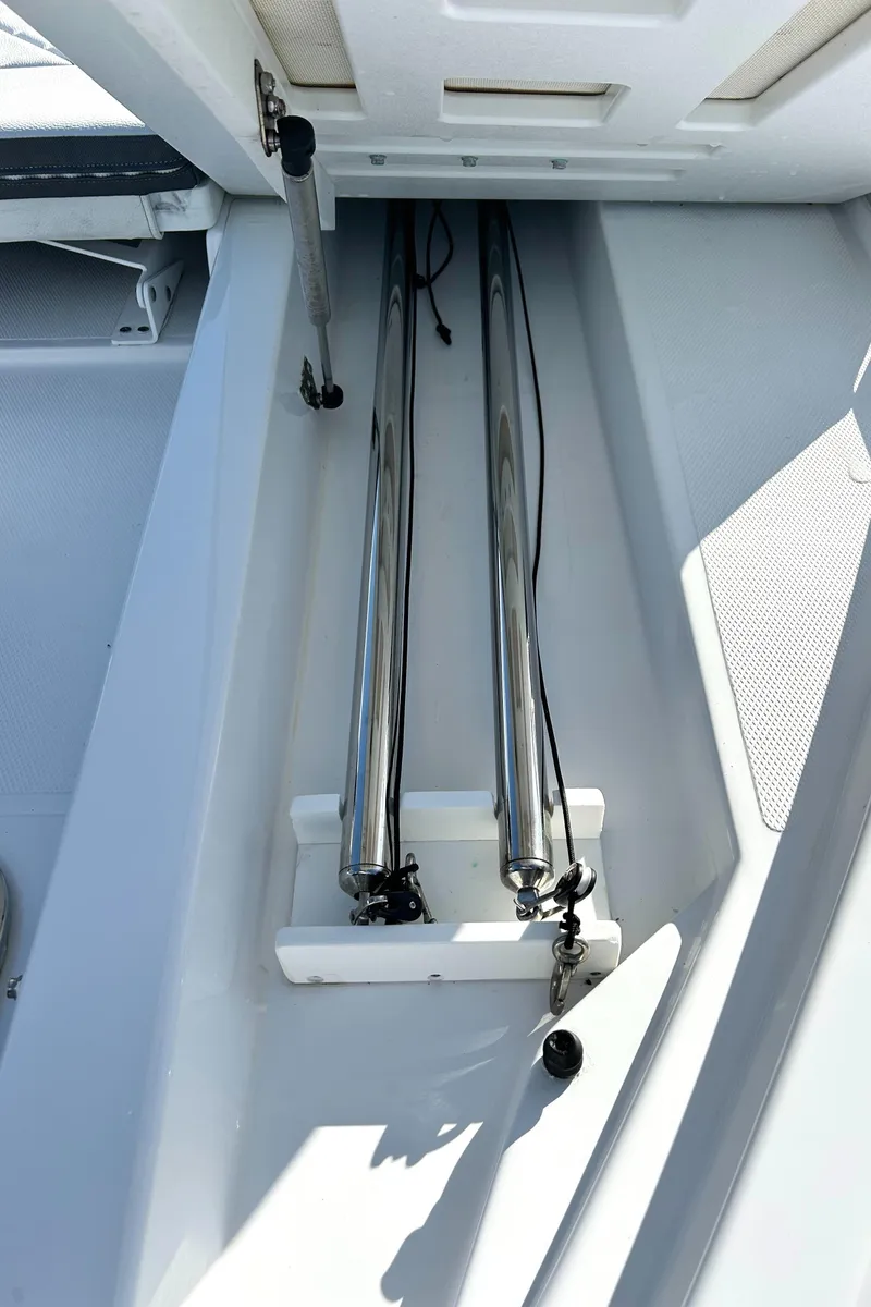 Slide: The Image of Storage compartment on a 2022 Cruisers Yachts 42 Cantius, featuring sleek metal poles. - 20