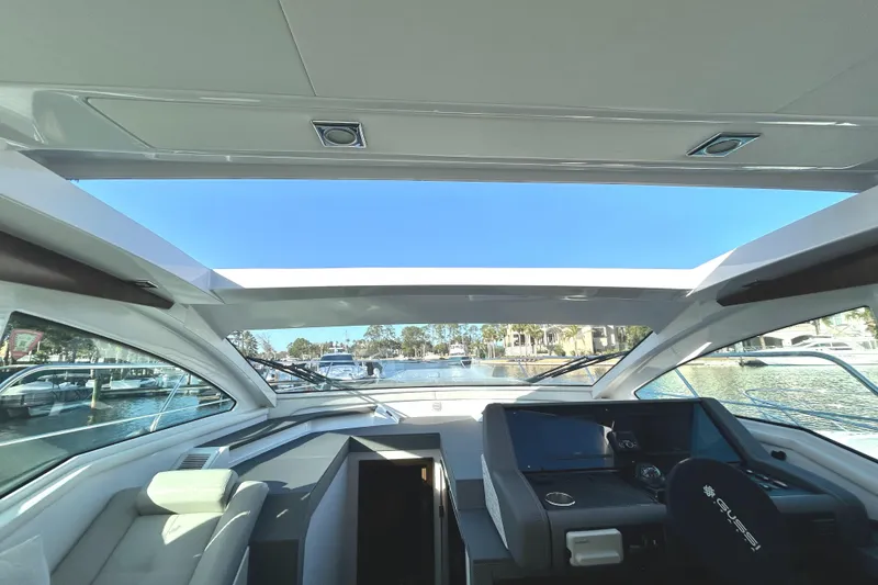 Slide: The Image of 2022 Cruisers Yachts 42 Cantius interior with panoramic windows and modern helm. - 33