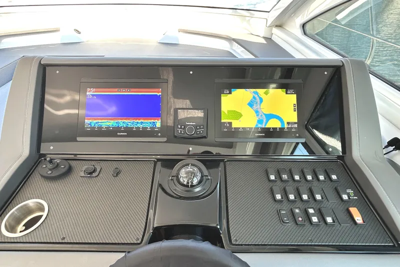 Slide: The Image of Helm of 2022 Cruisers Yachts 42 Cantius with navigation displays and controls. - 36