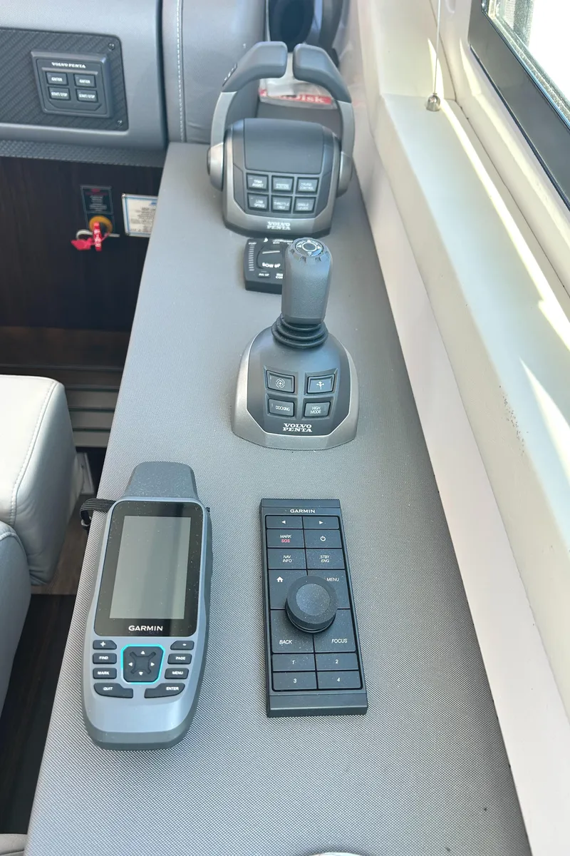 Slide: The Image of Control panel of 2022 Cruisers Yachts 42 Cantius with navigation and joystick controls. - 37