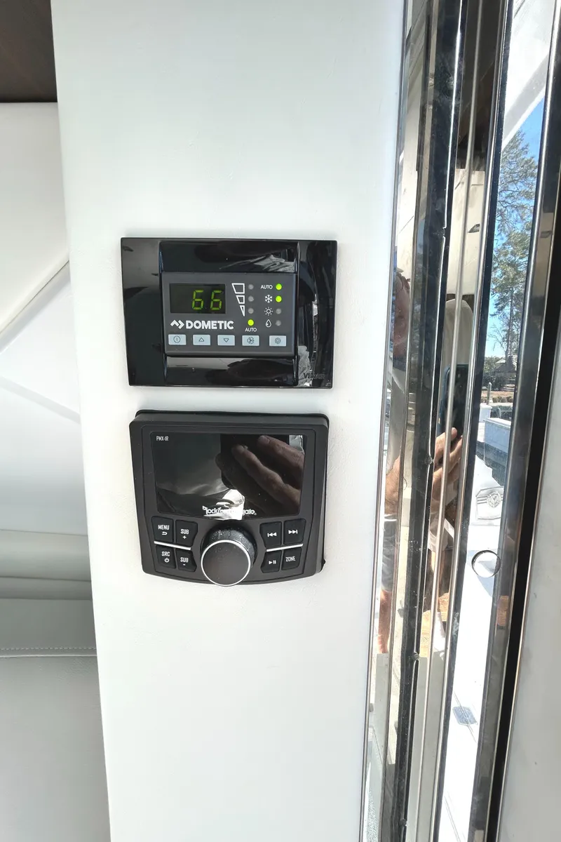 Slide: The Image of Control panel on 2022 Cruisers Yachts 42 Cantius, featuring Dometic display and audio system. - 41