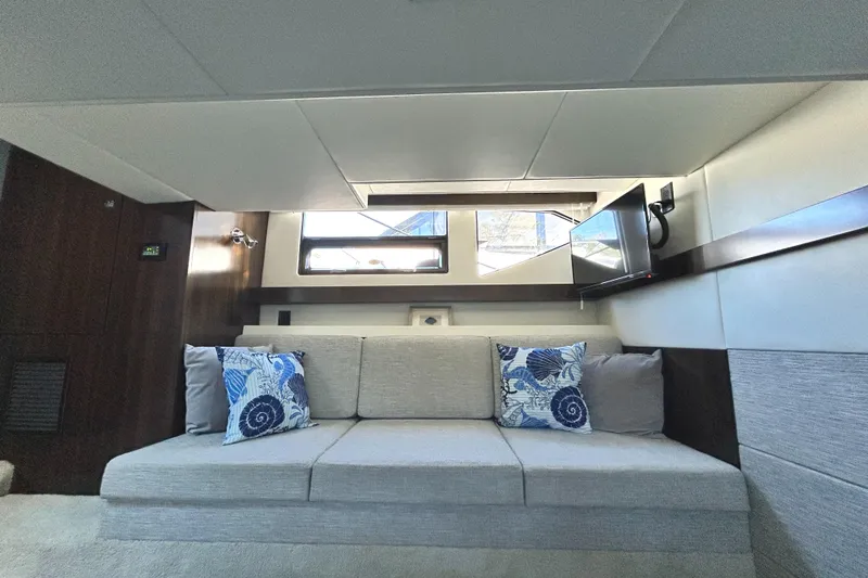 Slide: The Image of Interior of 2022 Cruisers Yachts 42 Cantius with modern sofa and decorative pillows. - 45