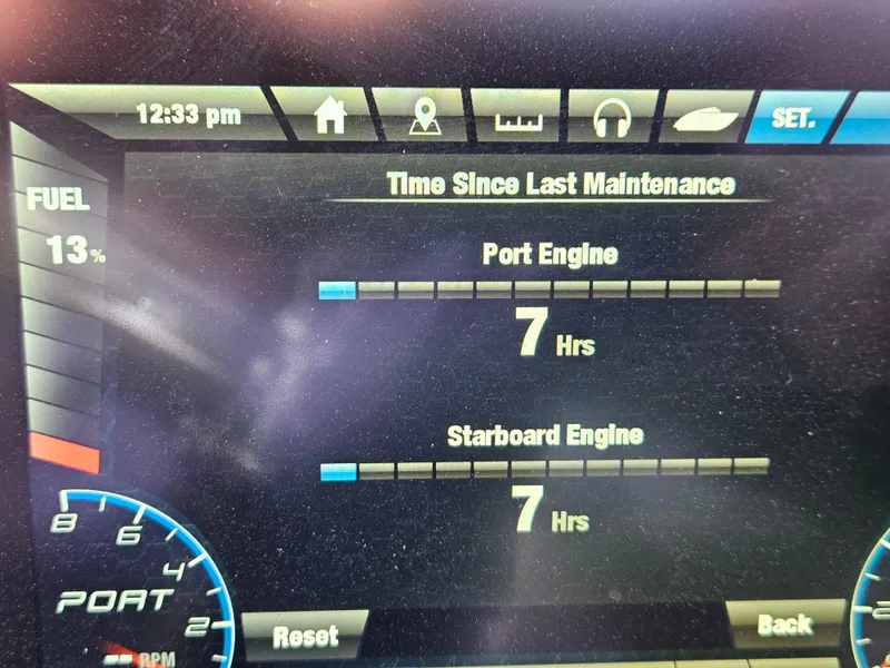 Slide: The Image of Dashboard display of a 2022 Yamaha Boats 212S showing engine maintenance hours and fuel level. - 11