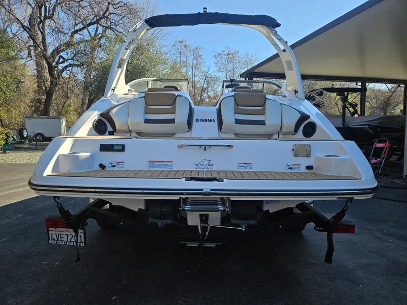 Slide: The Image of 2022 Yamaha Boats 212S, rear view, showcasing sleek design and dual seating. - 9