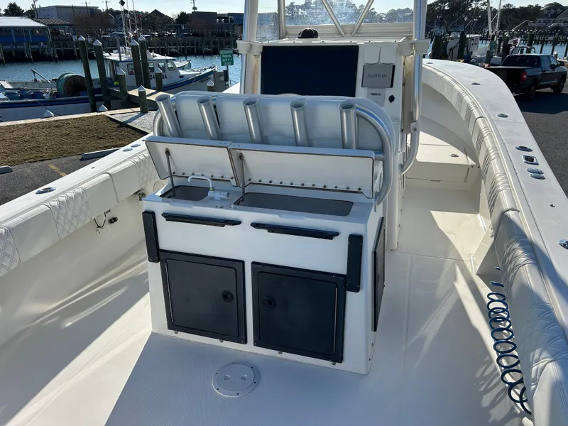 Slide: The Image of 2000 Regulator 32 Classic boat interior with helm station and storage compartments. - 11