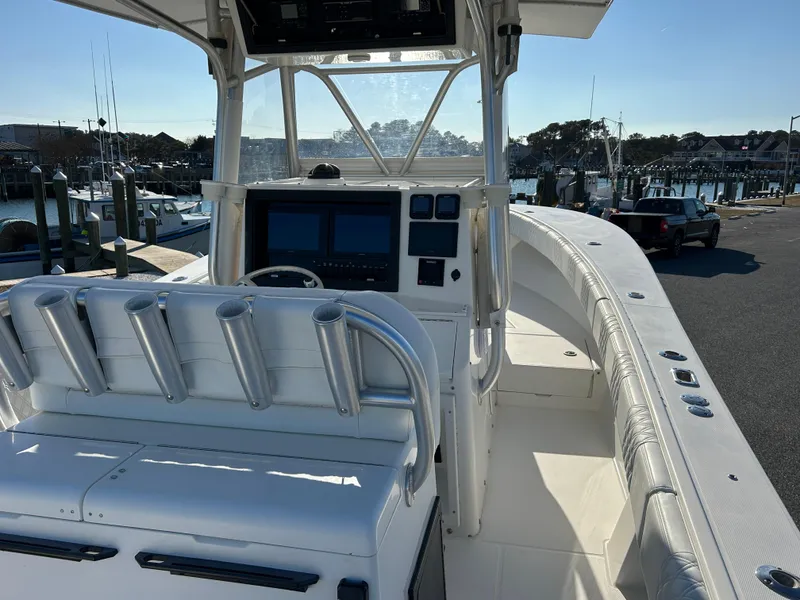 Slide: The Image of 2000 Regulator 32 Classic boat with helm station, docked at marina. - 12