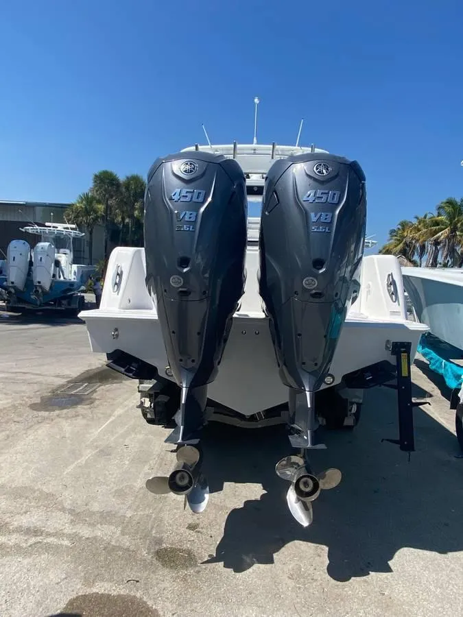 Slide: The Image of 2024 Contender 35 ST boat with dual Yamaha 425 V8 outboard engines. - 2