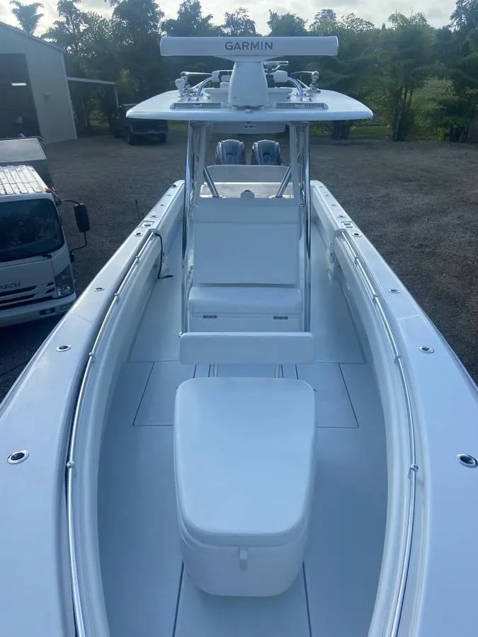 Slide: The Image of 2024 Contender 35 ST boat with Garmin equipment, parked outdoors. - 4