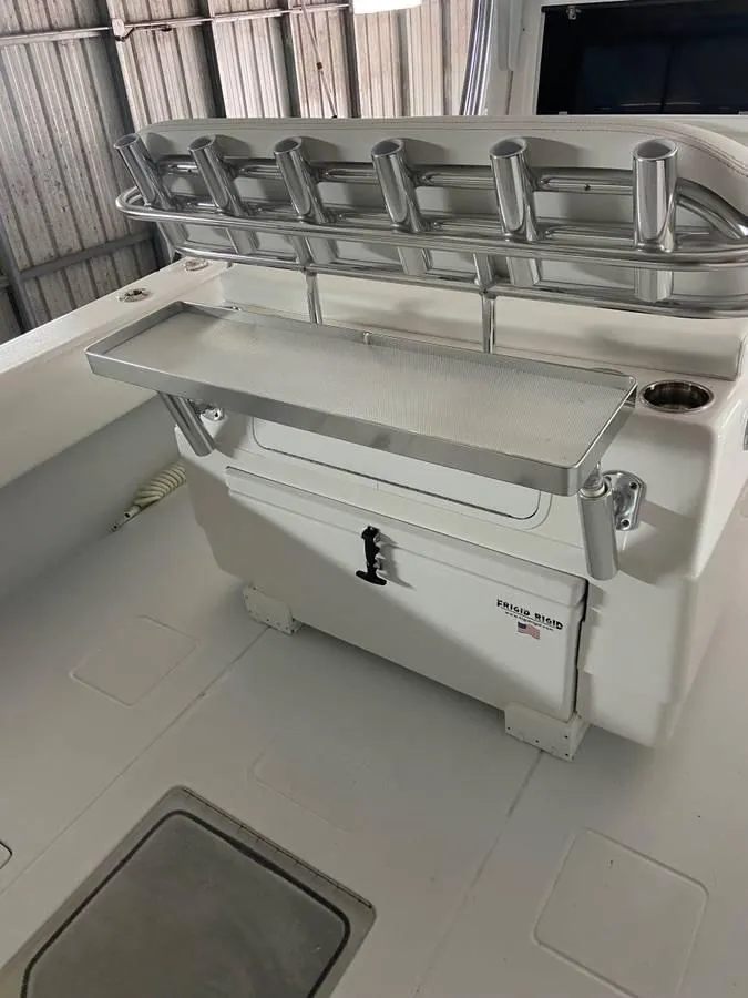 Slide: The Image of 2024 Contender 35 ST boat with rod holders and storage compartment. - 6