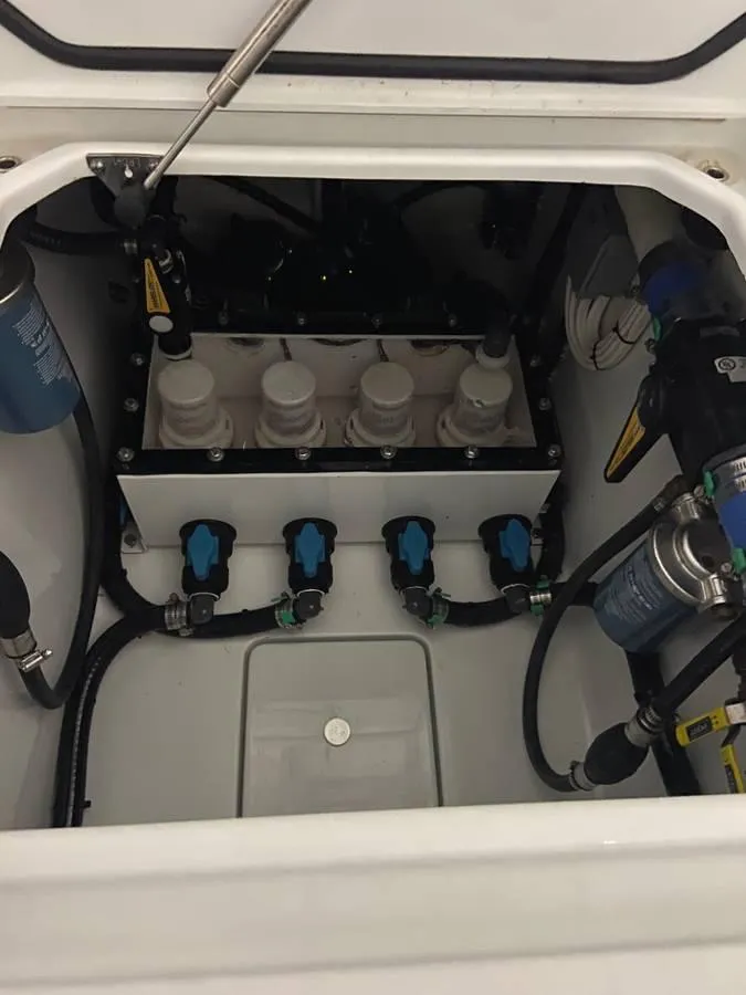 Slide: The Image of 2024 Contender 35 ST boat engine compartment with fuel and water systems. - 8