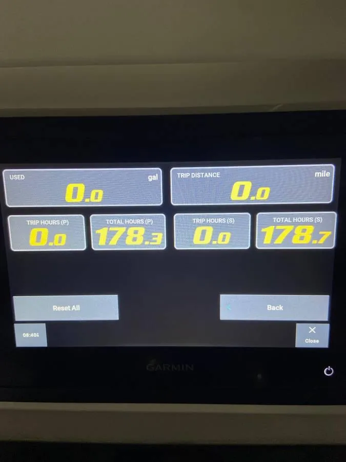 Slide: The Image of 2024 Contender 35 ST dashboard display showing trip and total hours. - 9