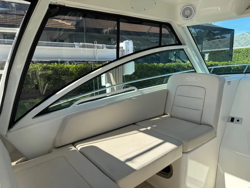 Slide: The Image of Interior seating of 2017 Boston Whaler 315 Conquest boat, featuring sleek design and comfort. - 13
