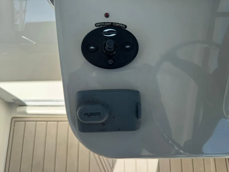 Slide: The Image of Control panel on a 2017 Boston Whaler 315 Conquest boat. - 21