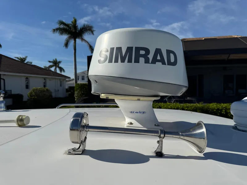 Slide: The Image of 2017 Boston Whaler 315 Conquest with Simrad radar and horn on deck. - 29