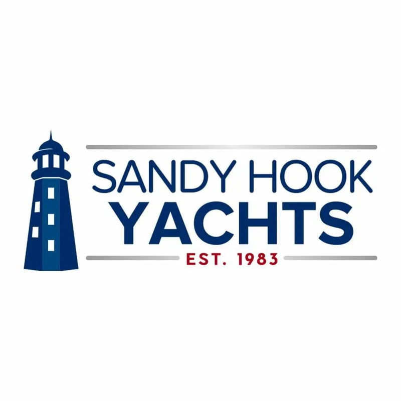 Slide: The Image of Logo of Sandy Hook Yachts with lighthouse, established in 1983. - 3