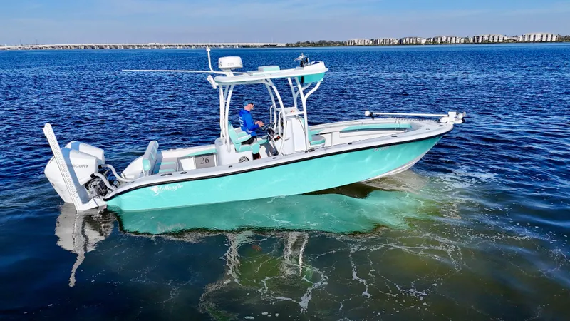 Slide: The Image of 2022 Yellowfin 26 Hybrid boat with twin 225 Mercury engines on calm water. - 10