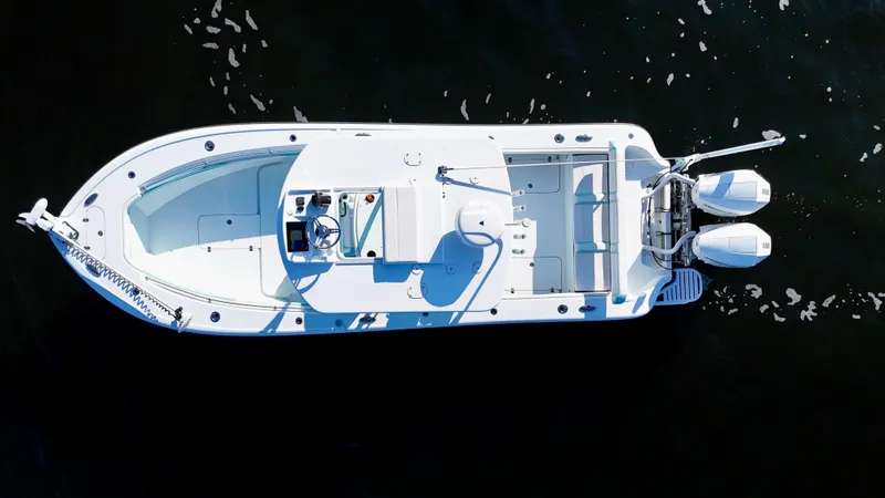 Slide: The Image of 2022 Yellowfin 26 Hybrid boat with twin 225 Mercury engines, aerial view. - 13