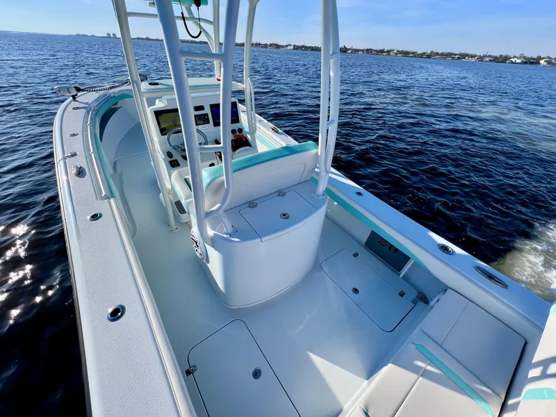 Slide: The Image of 2022 Yellowfin 26 Hybrid boat, twin 225 Mercury engines, only 36 hours, on open water. - 16