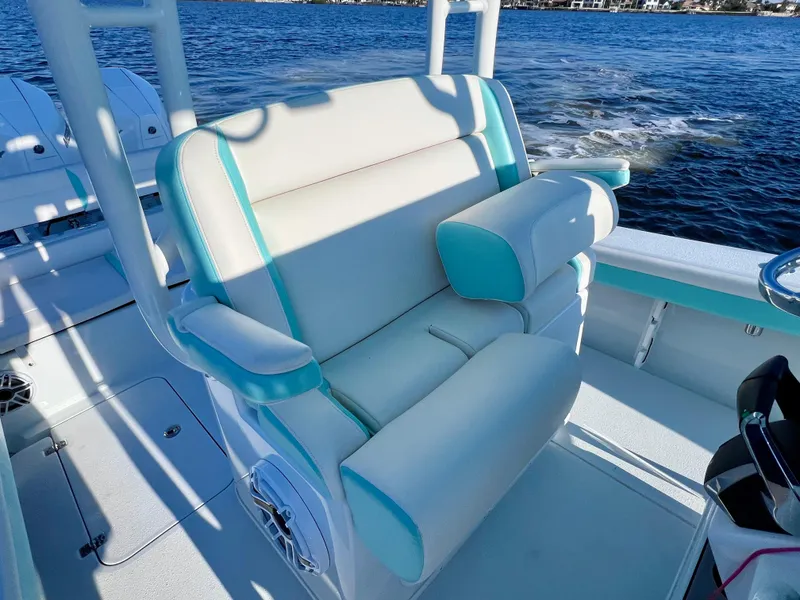Slide: The Image of Luxurious seating on 2022 Yellowfin 26 Hybrid boat, featuring twin 225 Mercury engines. - 25