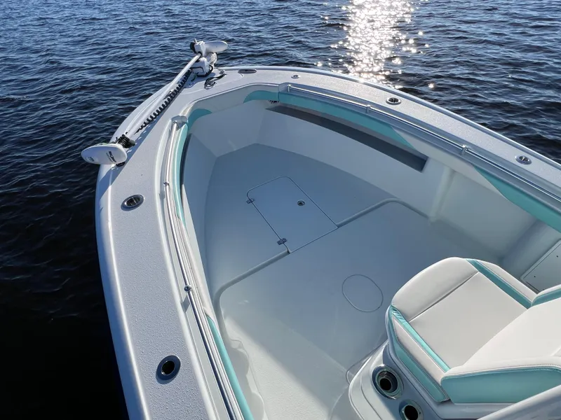 Slide: The Image of 2022 Yellowfin 26 Hybrid boat interior, spacious deck, on calm water. - 30