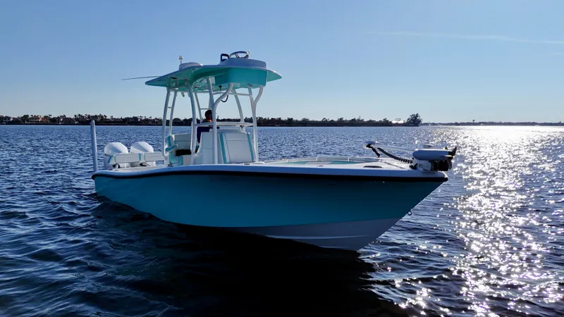 Slide: The Image of 2022 Yellowfin 26 Hybrid boat on water, twin 225 Mercury engines, 36 hours used. - 4