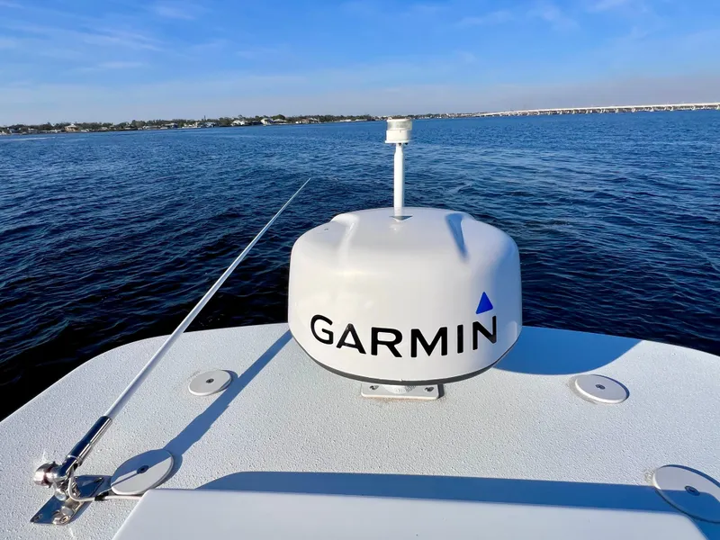 Slide: The Image of 2022 Yellowfin 26 Hybrid boat with Garmin radar on calm water. - 42