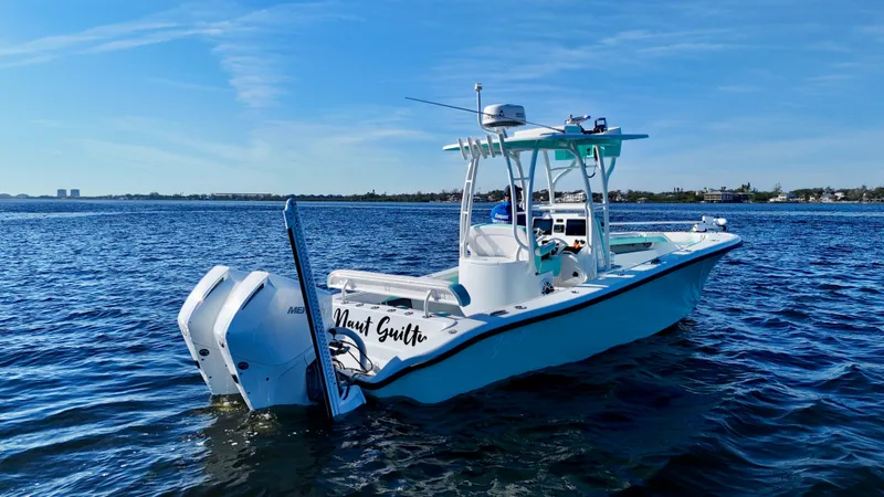 Slide: The Image of 2022 Yellowfin 26 Hybrid boat with twin 225 Mercury engines on calm water. - 5