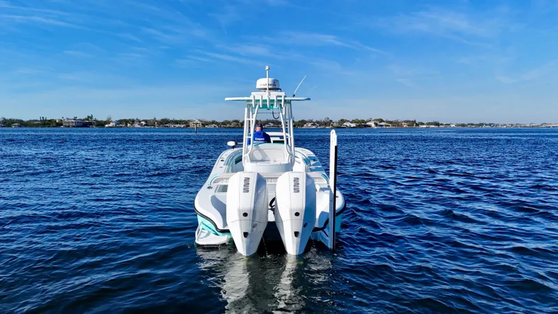 Slide: The Image of 2022 Yellowfin 26 Hybrid boat with twin 225 Mercury engines on open water. - 6