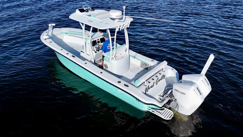 Slide: The Image of 2022 Yellowfin 26 Hybrid boat with twin 225 Mercury engines on water. - 8