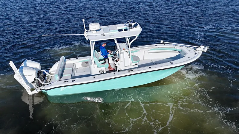 Slide: The Image of 2022 Yellowfin 26 Hybrid boat with twin 225 Mercury engines on water. - 9