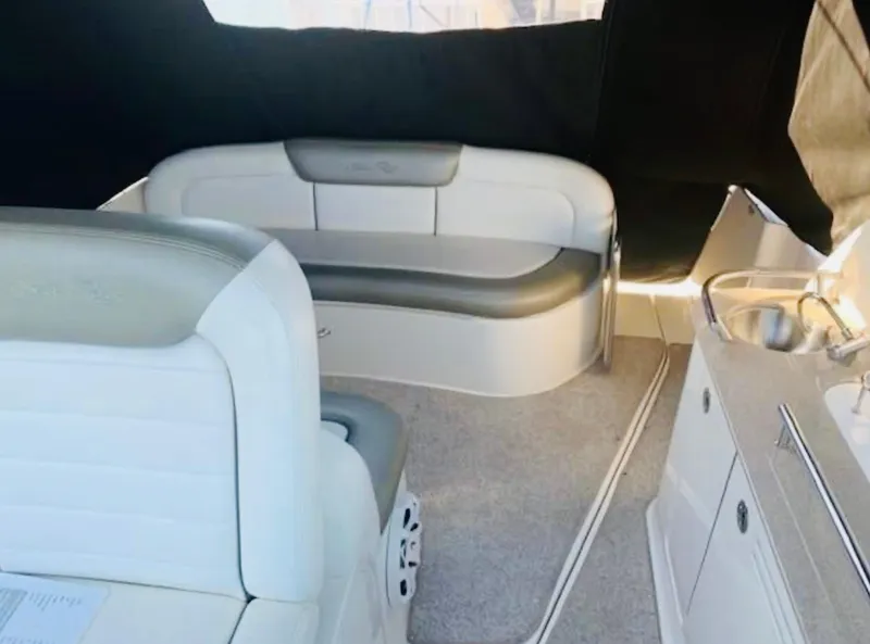 Slide: The Image of Interior of 2007 Sea Ray 310 Sundancer with seating and kitchenette. - 10