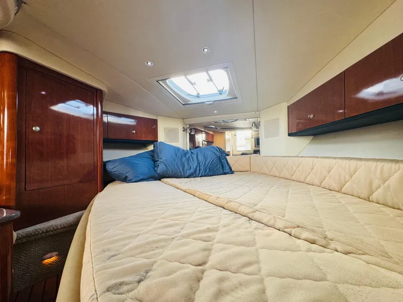 Slide: The Image of Interior cabin of 2007 Sea Ray 310 Sundancer with bed and skylight. - 14