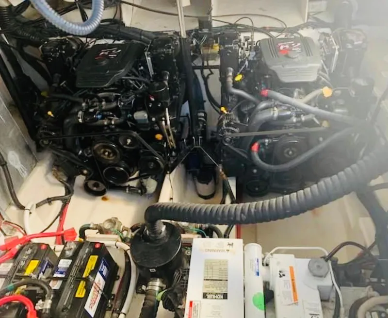 Slide: The Image of Engine room of 2007 Sea Ray 310 Sundancer with dual engines and batteries. - 22