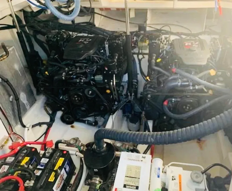 Slide: The Image of Engine room of 2007 Sea Ray 310 Sundancer with dual engines and batteries. - 23