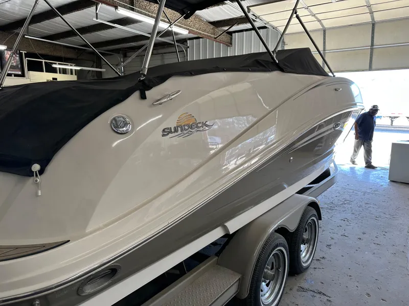 Slide: The Image of 2007 Sea Ray 260 Sundeck boat on trailer in a garage. - 5
