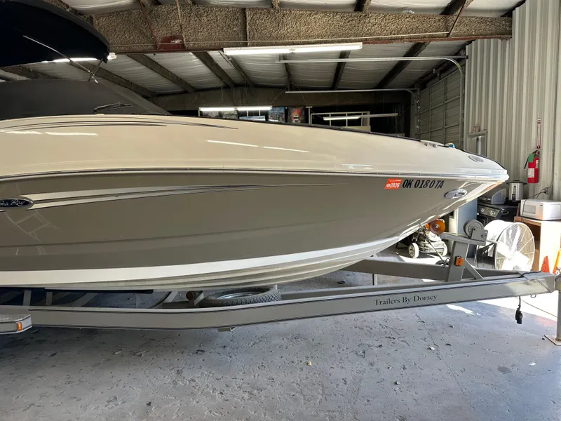 Slide: The Image of 2007 Sea Ray 260 Sundeck boat on trailer in a garage. - 7