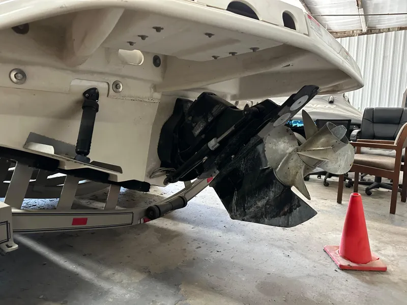 Slide: The Image of 2007 Sea Ray 260 Sundeck boat propeller and stern in a garage setting. - 8