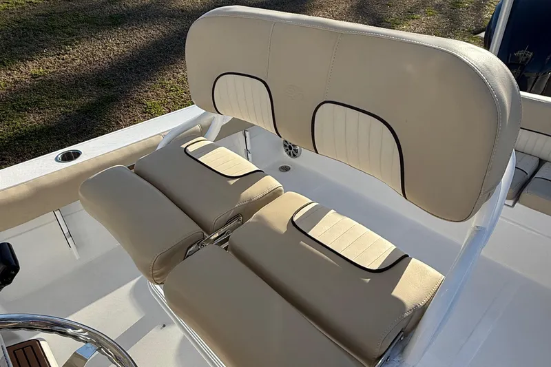 Slide: The Image of 2017 Sea Fox 246 Commander boat seating with beige upholstery and sleek design. - 11
