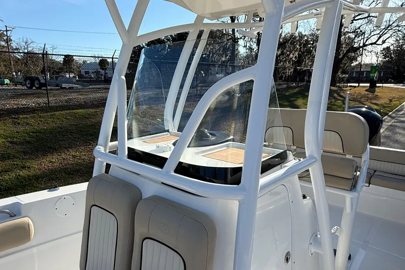 Slide: The Image of 2017 Sea Fox 246 Commander boat with center console and seating, docked outdoors. - 19