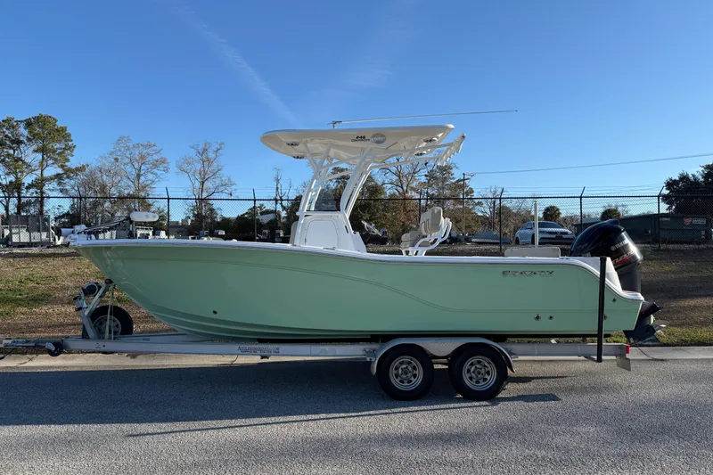 Slide: The Image of 2017 Sea Fox 246 Commander boat on trailer, parked outdoors. - 2