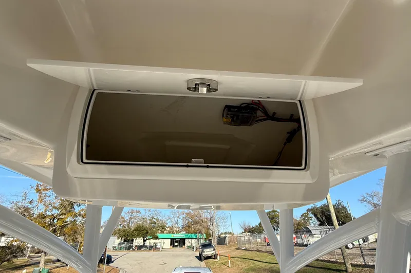 Slide: The Image of 2017 Sea Fox 246 Commander storage compartment with open hatch, showcasing interior space. - 27