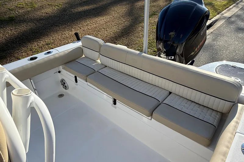 Slide: The Image of 2017 Sea Fox 246 Commander boat interior with cushioned seating and outboard motor. - 29